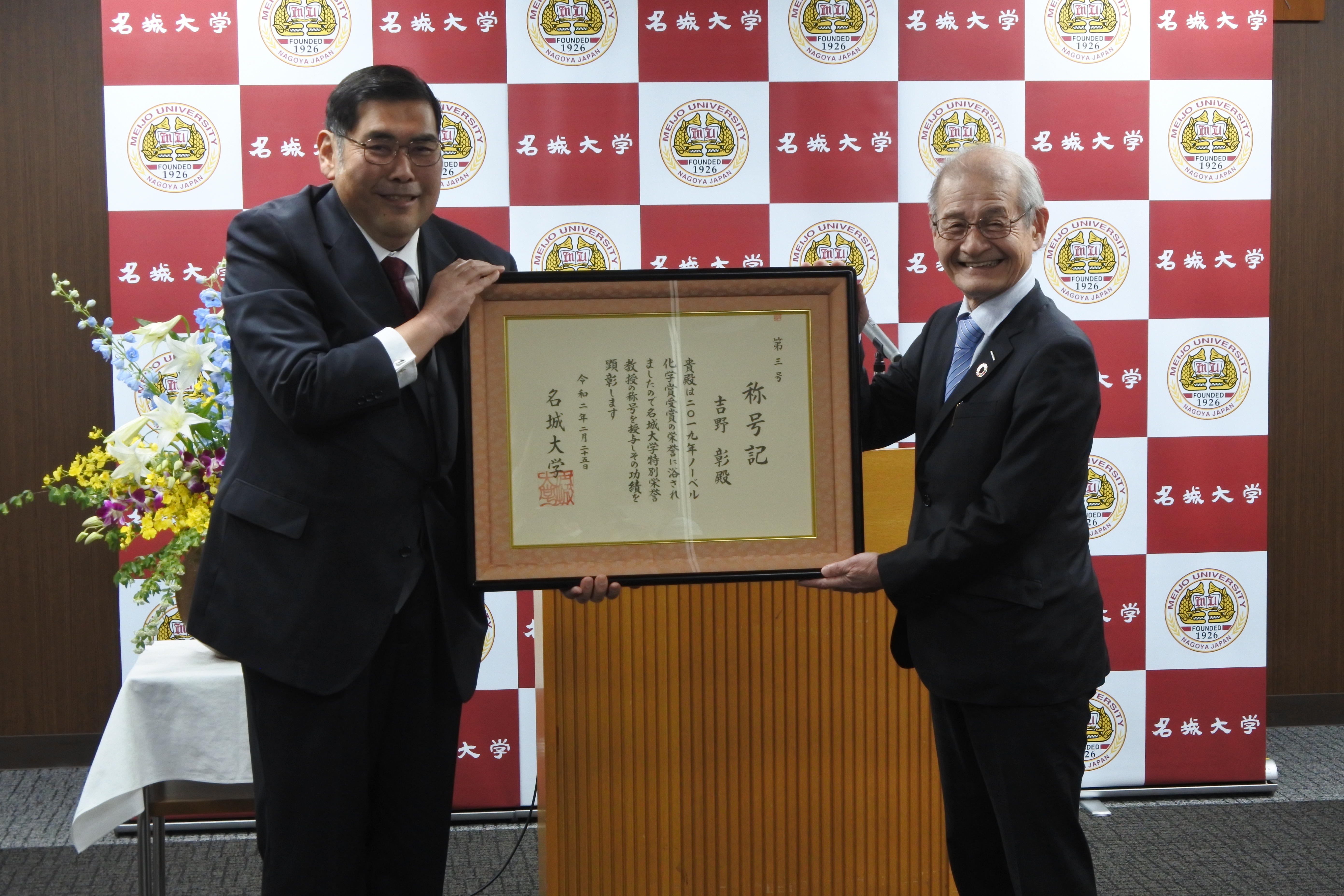 Dr. YOSHINO smiling with his certificate